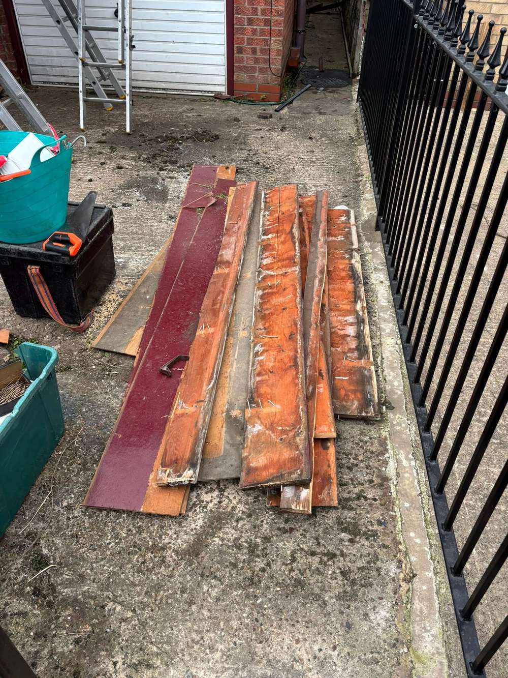 A pile of old torn-off fascia boards on the job